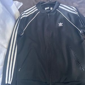 Black three striped Adidas jacket